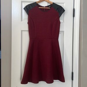 Fit and flare dress with faux leather piping  and detailing